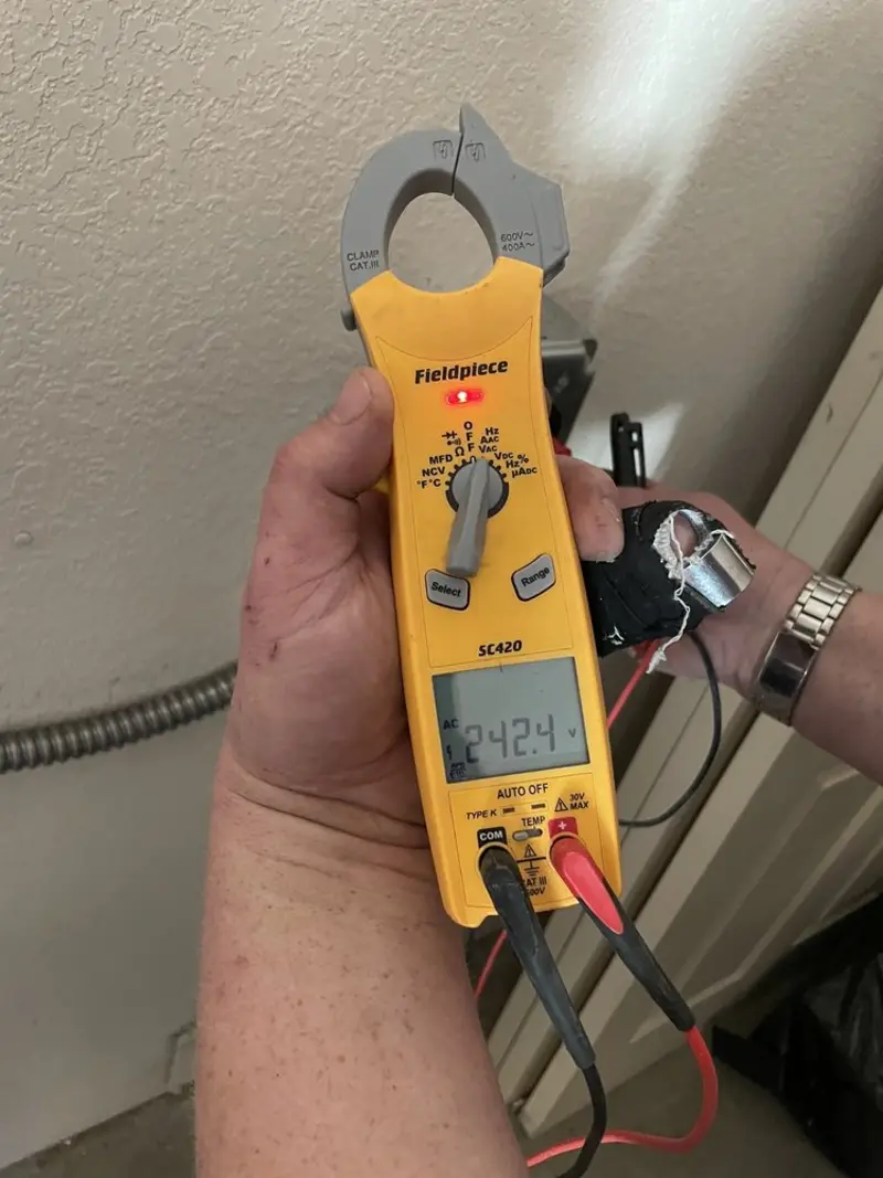 Voltage testing with clamp meter during Recessed Lighting Installation in Van Buren